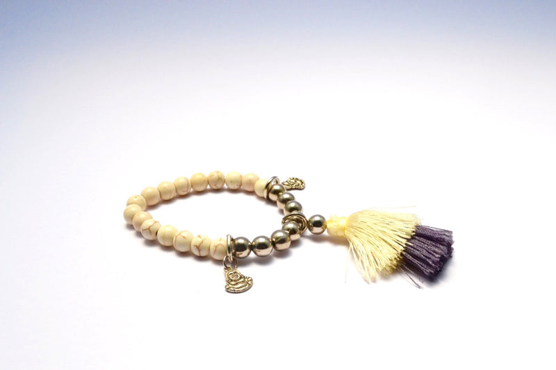 CREMA STONE WITH TINY BUDDHA BANGLES & FAUX SILVER ROUND BEADS W MULTICOLORED TASSEL BRACELET.
